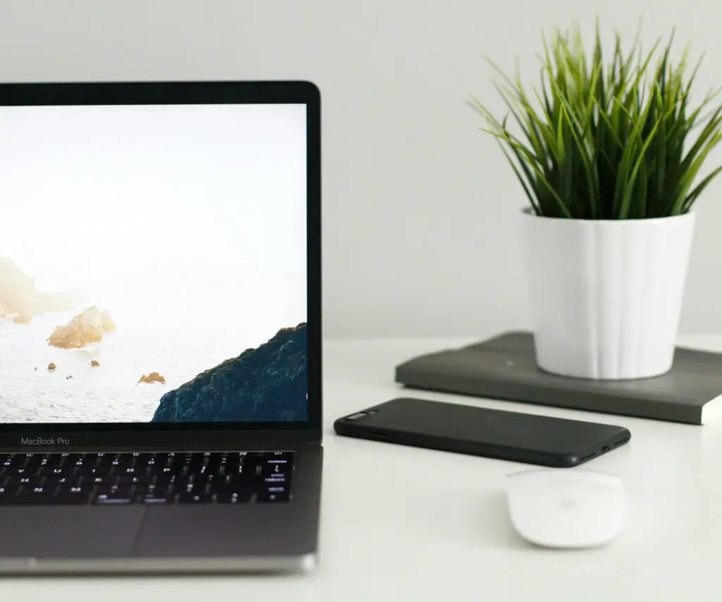 Marketing strategist's laptop and phone on a desk