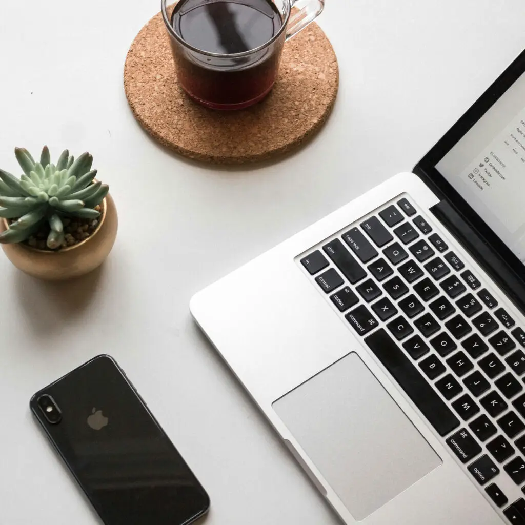 Laptop and phone on a desk working on a website build